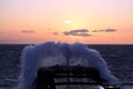 The movement of the vessel against the waves during a heavy storm. Sunset.North Pacific ocean. Royalty Free Stock Photo