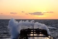 The movement of the vessel against the waves during a heavy storm. Sunset.North Pacific ocean. Royalty Free Stock Photo