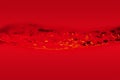 The movement of water in the middle of the frame on a red background. Royalty Free Stock Photo