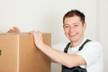 Mover with boxes in the course of relocation Royalty Free Stock Photo