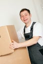 Mover with boxes in the course of relocation Royalty Free Stock Photo