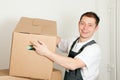 Mover with boxes in the course of relocation Royalty Free Stock Photo
