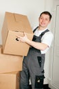 Mover with boxes in the course of relocation Royalty Free Stock Photo
