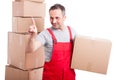 Mover guy holding cardboard box using invisible touch screen Royalty Free Stock Photo