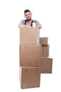 Mover man having coffee on cardboard boxes Royalty Free Stock Photo