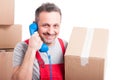 Mover man holding box and big telephone receiver Royalty Free Stock Photo