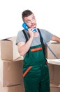 Mover man holding cardboard box talking at telephone Royalty Free Stock Photo
