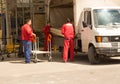 Movers in red suits