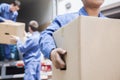 Movers unloading a moving van Royalty Free Stock Photo