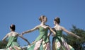 Moves of the three teenage ballet dancers are graceful