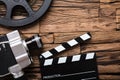 Movie Camera With Film Reel And Clapper Board On Wood Royalty Free Stock Photo