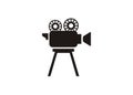 Movie camera with film roll. Simple illustration in black and white Royalty Free Stock Photo