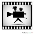 Movie camera at film strip isolated on a white background. stock vector illustration. Royalty Free Stock Photo