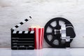 Movie Camera With Popcorn And Clapper Board Royalty Free Stock Photo