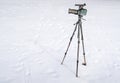 Movie camera with telescope attachment and tripod