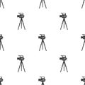 Movie camera on a tripod. Making a movie single icon in black style vector symbol stock illustration web. Royalty Free Stock Photo