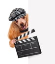 Movie clapper board director dog. Royalty Free Stock Photo