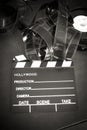 Movie clapper board and filmstrip selective focus Royalty Free Stock Photo