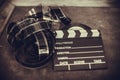 Movie clapper board and filmstrip selective focus Royalty Free Stock Photo