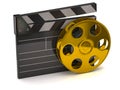 Movie clapper board and golden film reel Royalty Free Stock Photo