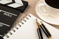 Movie clapper, cup of coffee and fountain pen diary Royalty Free Stock Photo