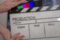Movie clapper and editing room in background Royalty Free Stock Photo