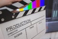 Movie clapper and editing room in background Royalty Free Stock Photo