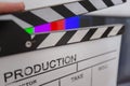 Movie clapper and editing room in background Royalty Free Stock Photo