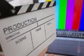 Movie clapper and editing room in background Royalty Free Stock Photo