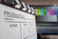 Movie clapper and editing room in background Royalty Free Stock Photo