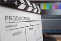 Movie clapper and editing room in background Royalty Free Stock Photo