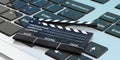 Movie clapper on a laptop. 3d illustration Royalty Free Stock Photo