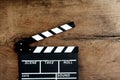 Movie clapper on old wooden background