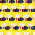 Movie delicious popcorn paper bucket icon. Food container with red and white stripes seamless pattern. Vector isometric