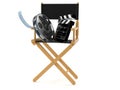 Movie director chair with film reel and clapboard Royalty Free Stock Photo