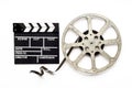 Movie film reel with clapperboard. Cinema concept Royalty Free Stock Photo