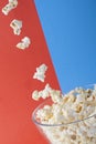Movie items, 3D glasses and popcorn in a cup. Royalty Free Stock Photo