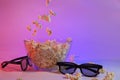 Movie items, 3D glasses and popcorn in a cup.. Royalty Free Stock Photo