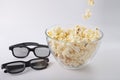 Movie items, 3D glasses and popcorn in a cup.. Royalty Free Stock Photo