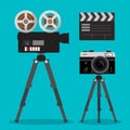 Movie and Photo Film Cameras Set on Tripods.