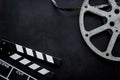 Movie premiere concept with clapperboard, film type on black background top view space for text Royalty Free Stock Photo