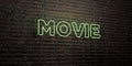 MOVIE -Realistic Neon Sign on Brick Wall background - 3D rendered royalty free stock image