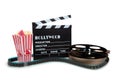 Movie reel with clapboard and popcorn Royalty Free Stock Photo