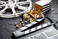 Movie reel with popcorn and clapperboard. Cinema background Royalty Free Stock Photo