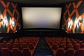 Movie screen and red chairs inside of a cinema Royalty Free Stock Photo