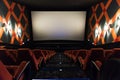 Movie screen and red chairs inside of a cinema Royalty Free Stock Photo