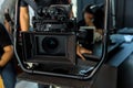 Movie shooting or video production and film crew team with camera equipment. Video camera operator working with equipment. Directo Royalty Free Stock Photo