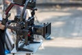 Movie shooting or video production and film crew team with camera equipment. Video camera operator working with equipment. Directo