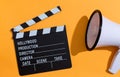 Movie slateboard clapper with megaphone Royalty Free Stock Photo