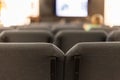 Movie theater auditorium with gray seats